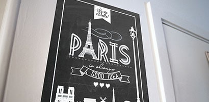 A Paris themed poster mounted using Command poster Strips.