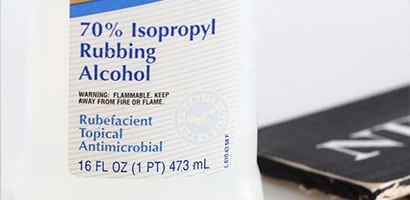 Front view of a bottle of 70% isopropyl rubbing alcohol.